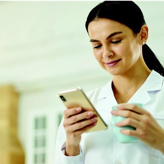 Women at work with phone