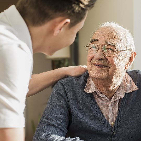 Caregiver with elderly man