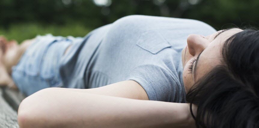 Woman lying and resting on floor