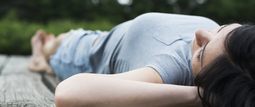 Woman lying and resting on floor